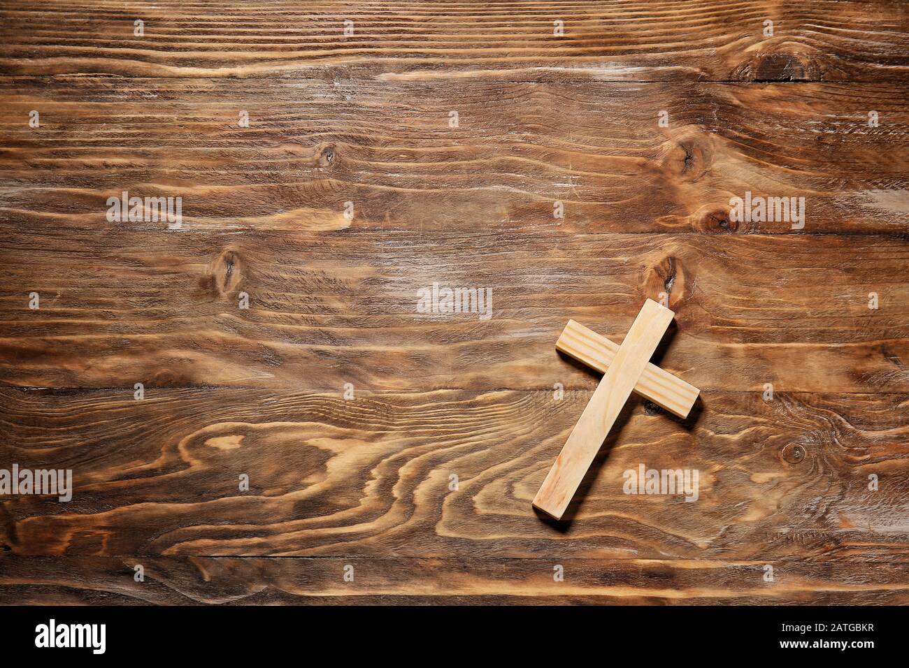 Christian cross on wooden background Stock Photo - Alamy