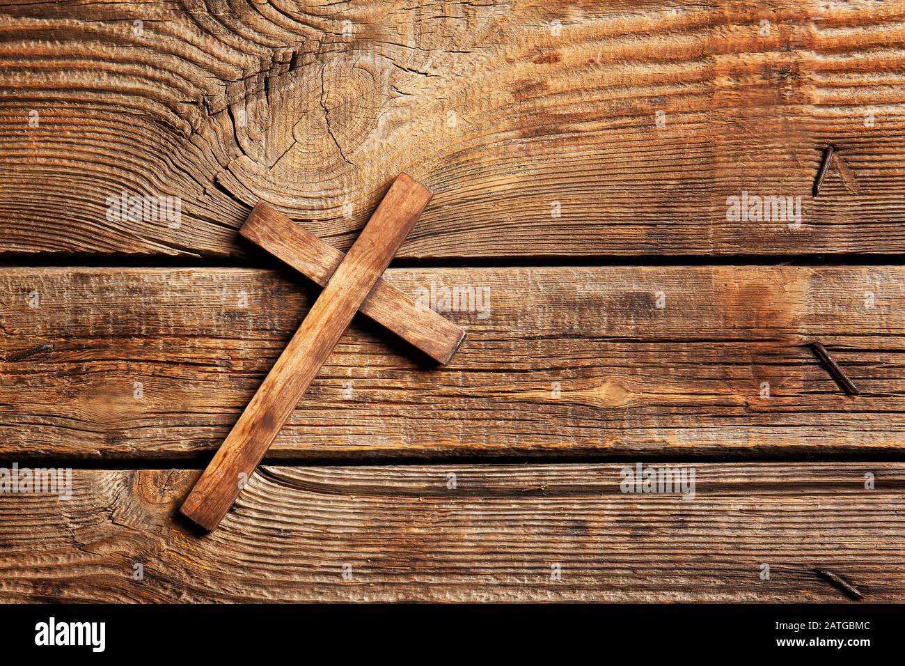 Christian cross on wooden background Stock Photo - Alamy