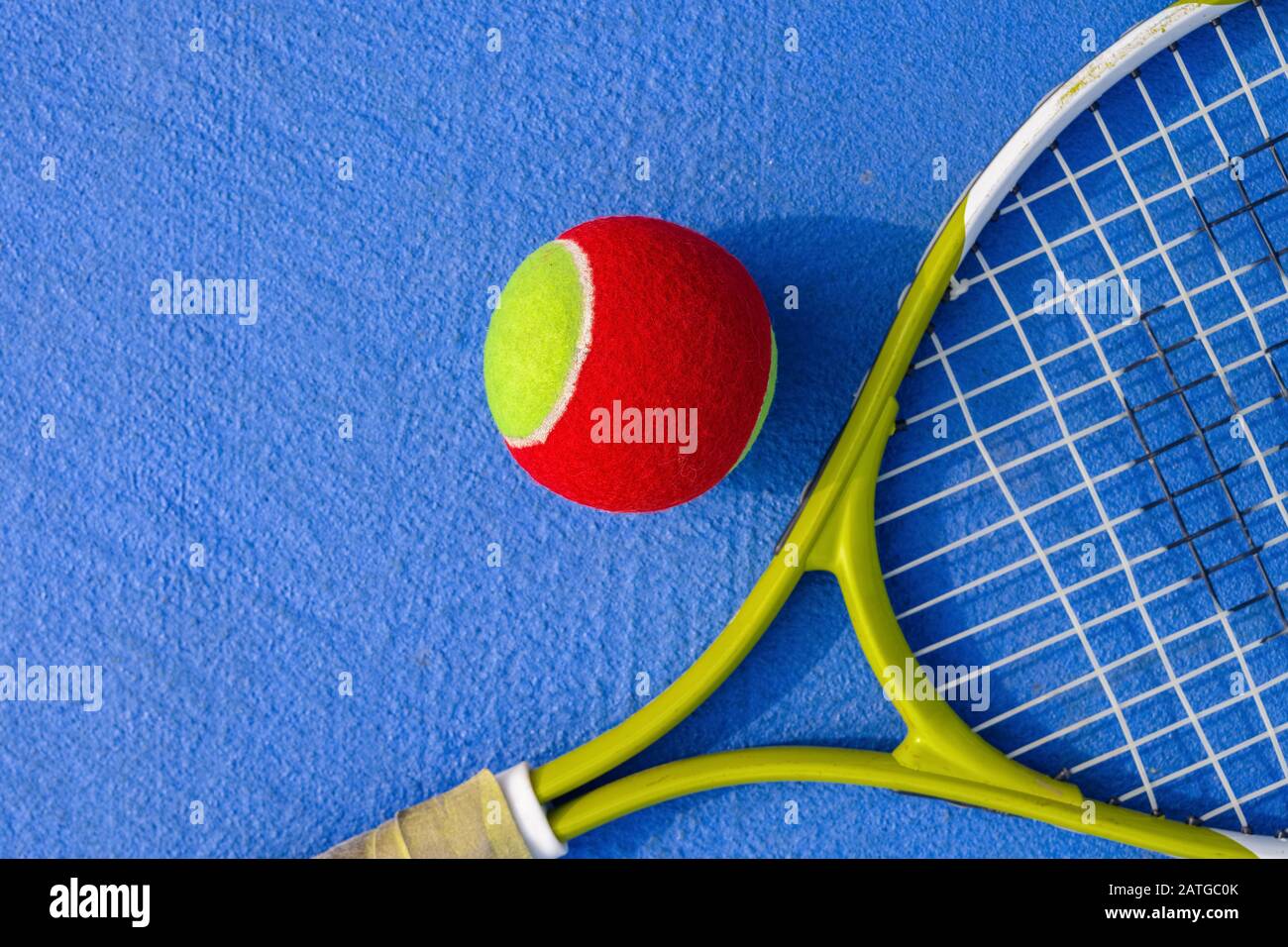 tennis ball and racket in an outdoor court Stock Photo - Alamy