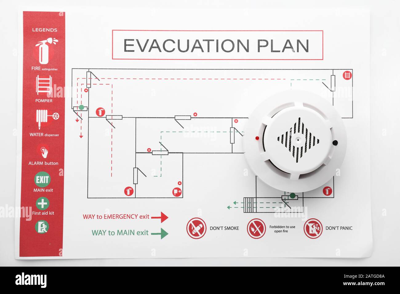 Evacuation plan and smoke detector on white background Stock Photo Alamy
