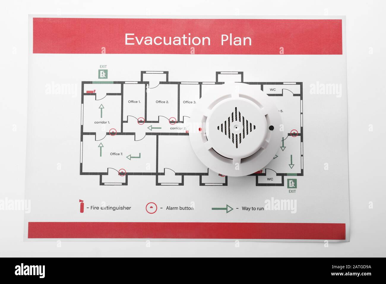 Evacuation plan and smoke detector on white background Stock Photo Alamy