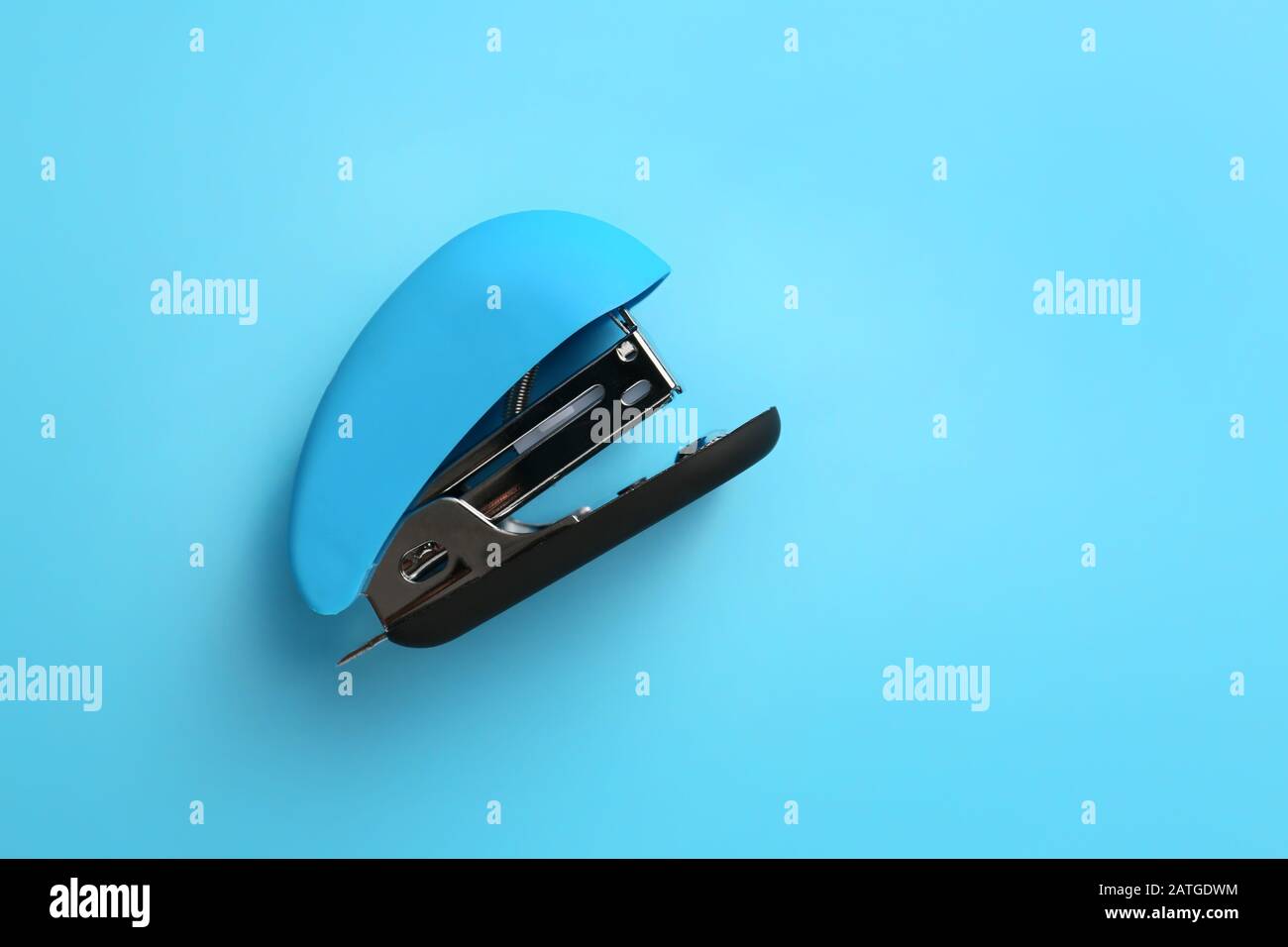Office stapler on color background Stock Photo - Alamy