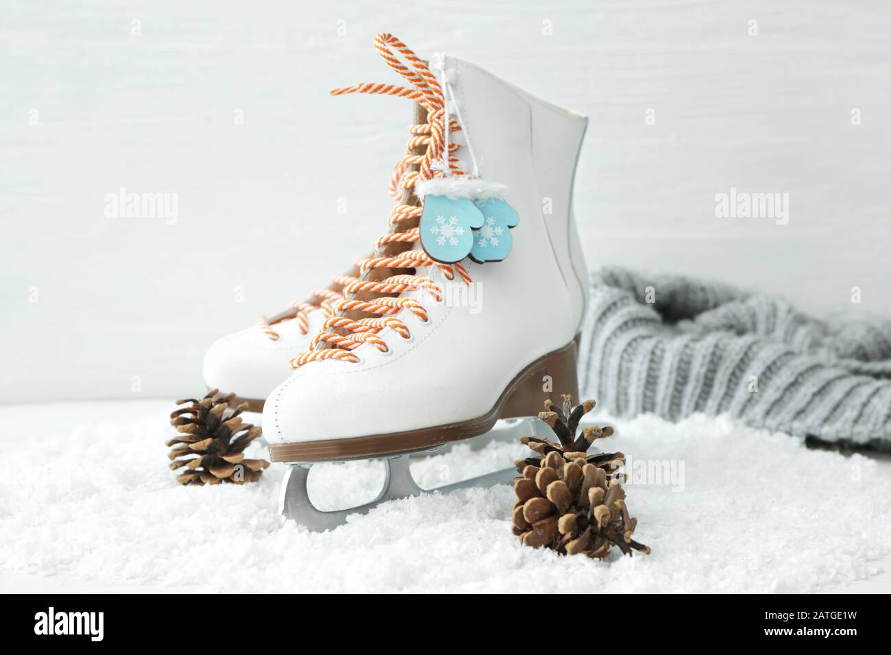 Ice skate shoes with snow and cones on white background Stock Photo Alamy