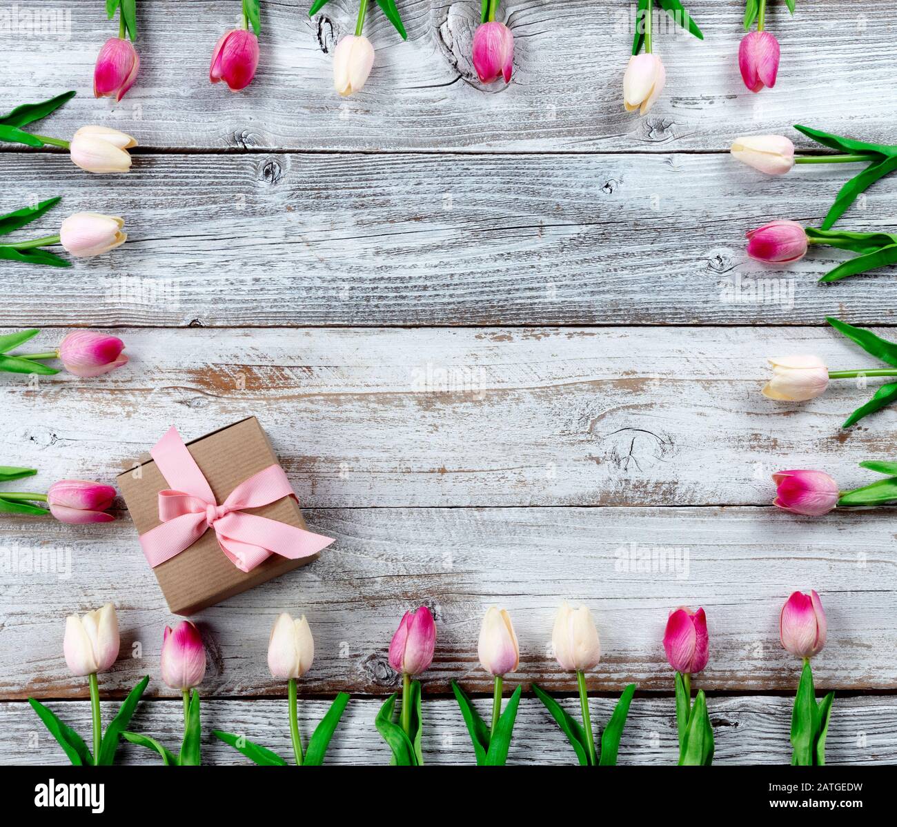 Happy Mothers Day holiday concept with brown gift box and border of