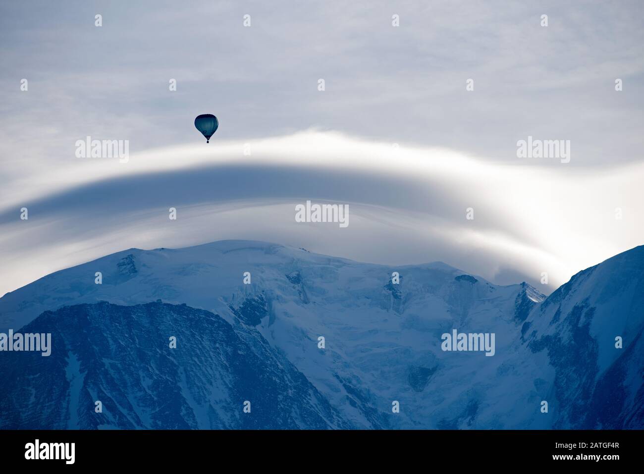 France, Haute-Savoie (74), Alps, Mont Blanc (4807 m) with lenticular cloud and hot air balloon Stock Photo