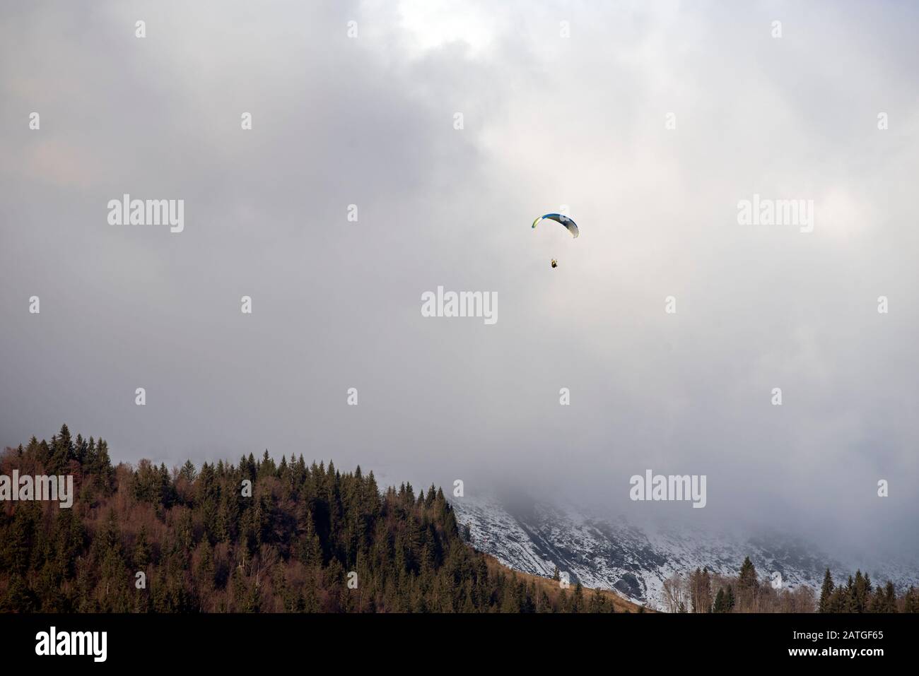 France, Haute-Savoie (74), Alps, mountains and clouds; paraglider Stock Photo