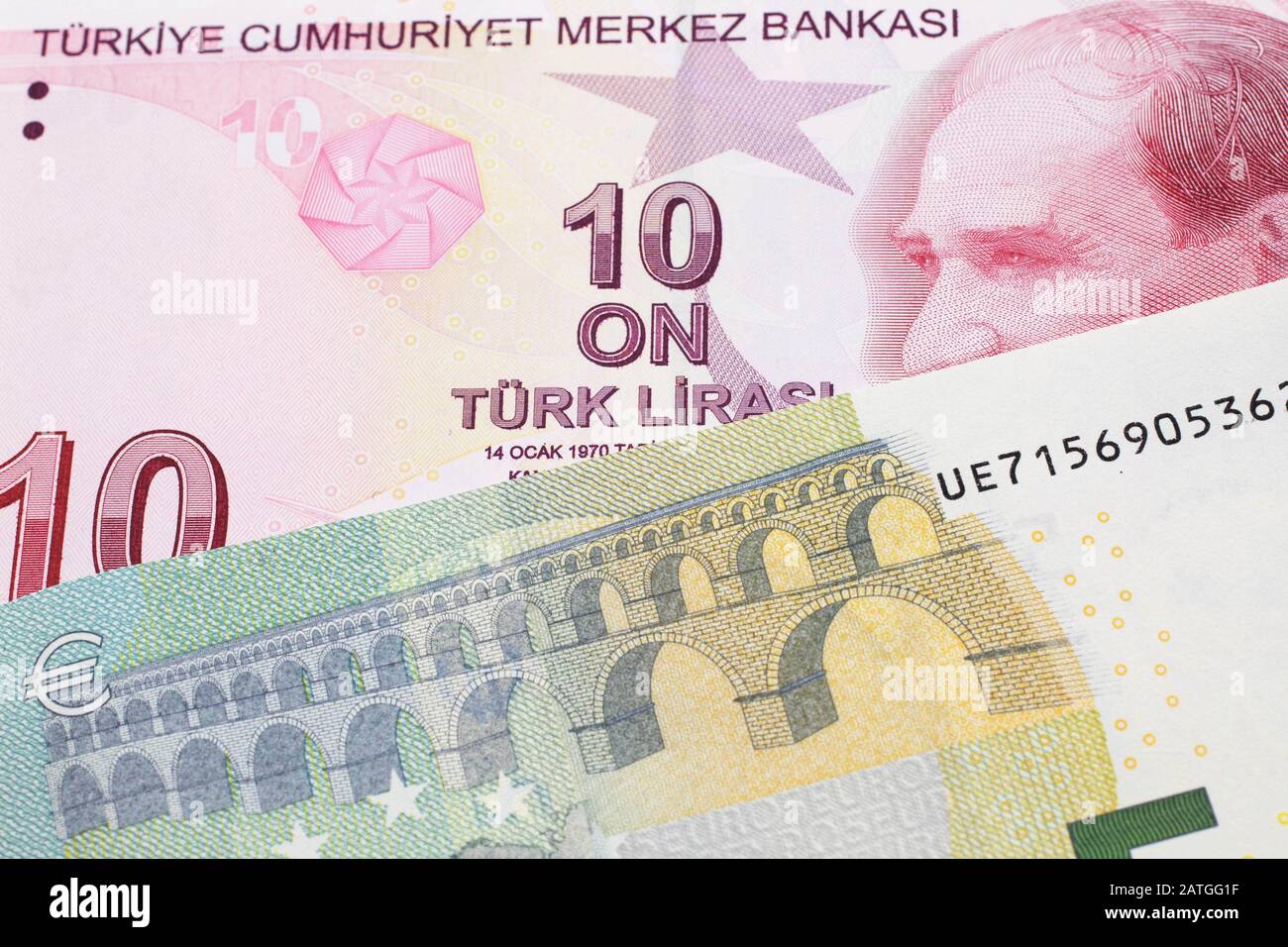 A red ten Turkish lira bill close up in macro with a red, European five Euro  note Stock Photo - Alamy