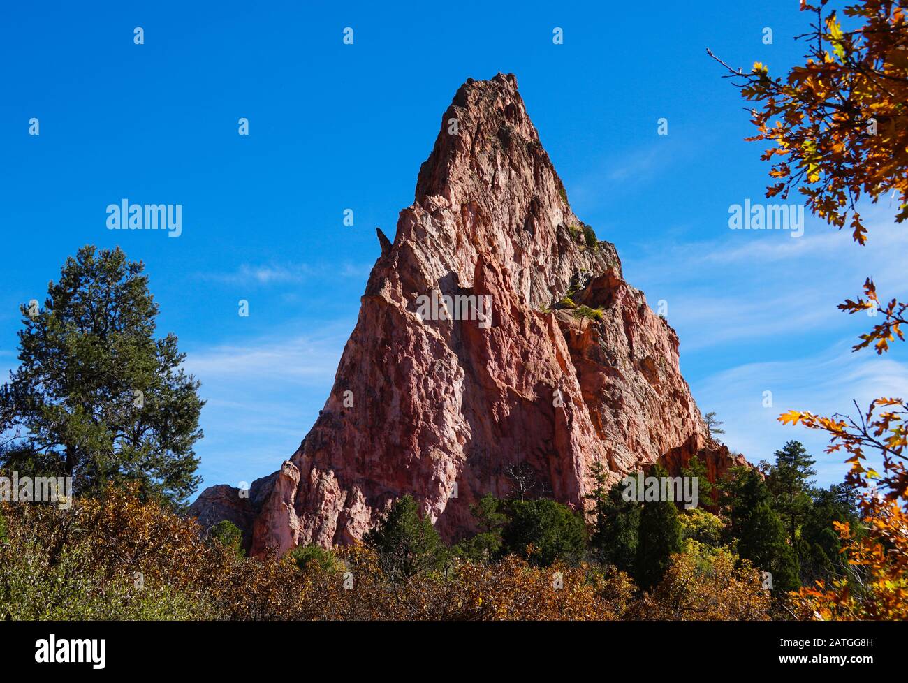 A triangular shaped sandstone formation marks one of the sides of Perkins Central Garden in Garden of the Gods. Stock Photo