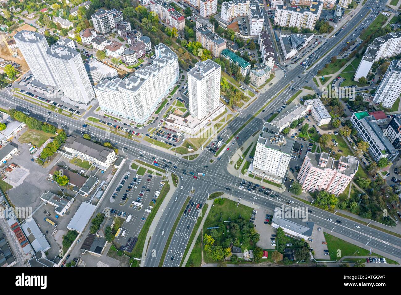aerial view of residential district with apartment buildings and road intersection with car movement Stock Photo