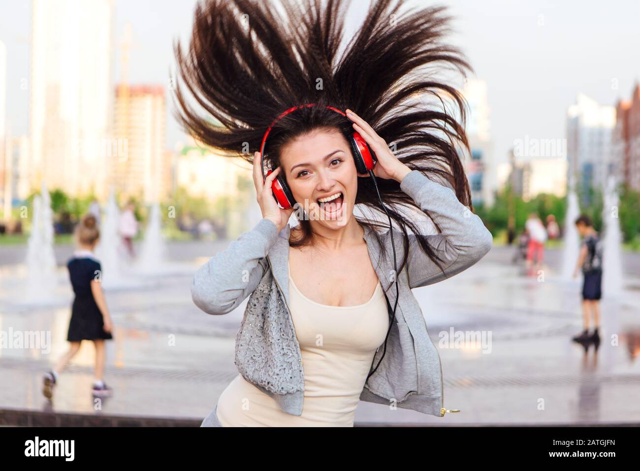 Girl listening to music streaming with headphones Stock Photo Alamy