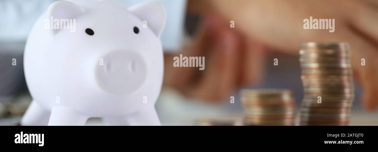 Hand businessman putting pin money Stock Photo Alamy