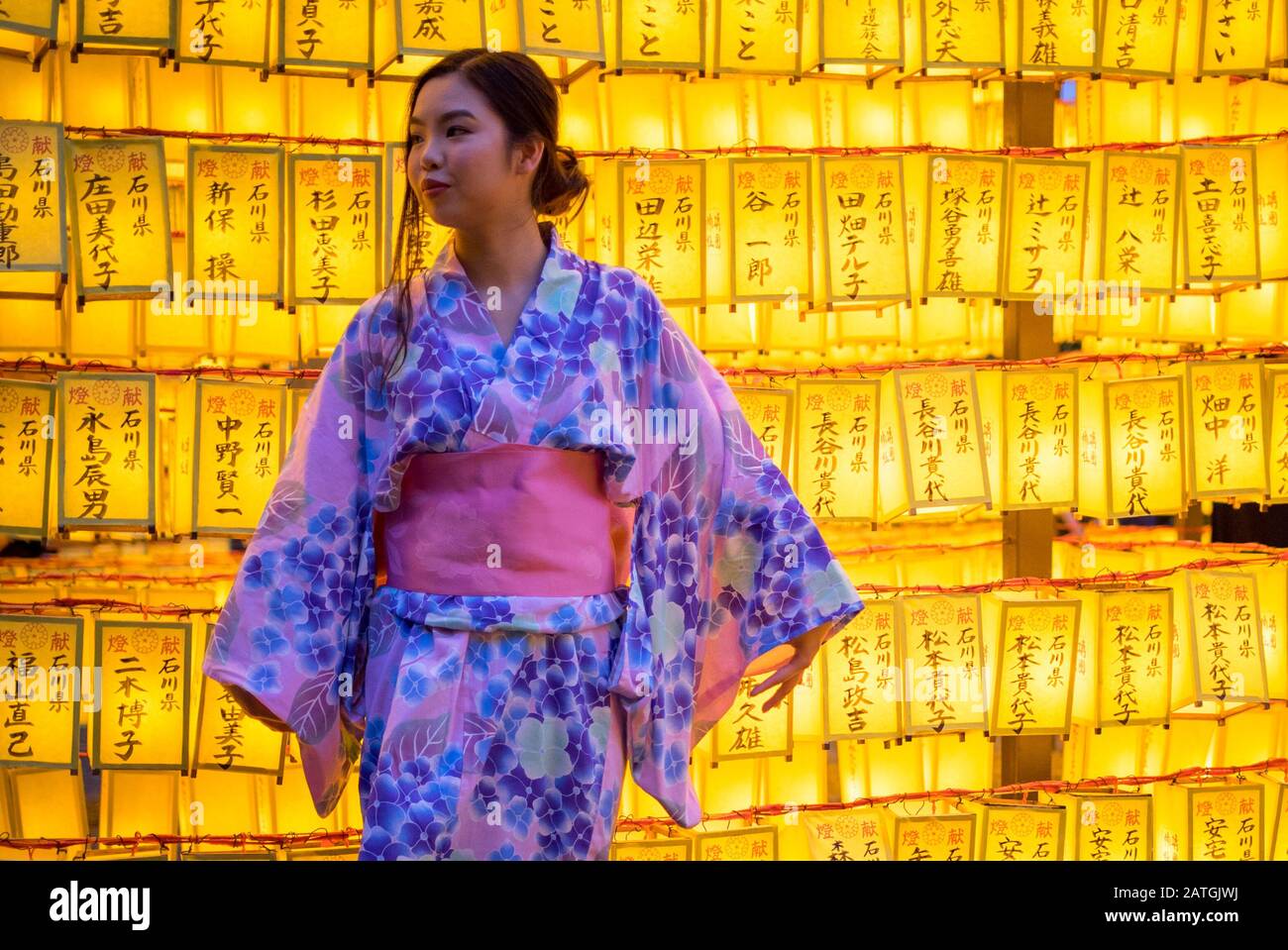 Japanese girl in a yukata kimono, 2018 Mitama Matsuri (Mitama Festival), a famous Japanese Obon (Bon) summer festival. Yasukuni Shrine, Tokyo, Japan. Stock Photo