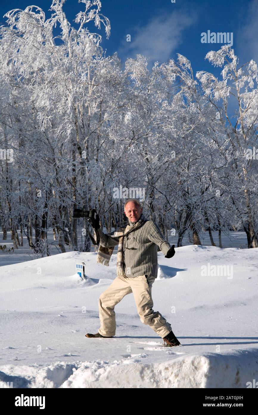 Photographer in the snow, Stock Photo