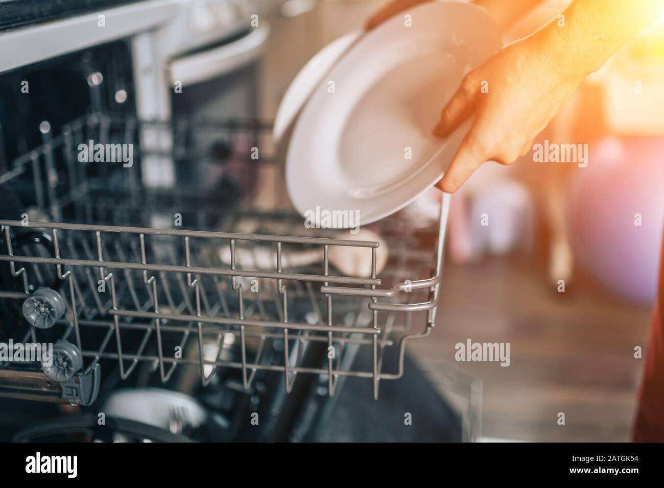 Dishwasher machine, woman hands Stock Photo Alamy