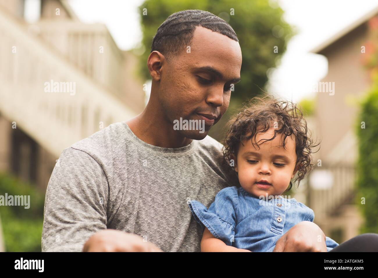 Father holding his little girl. Mixed race family. Stock Photo