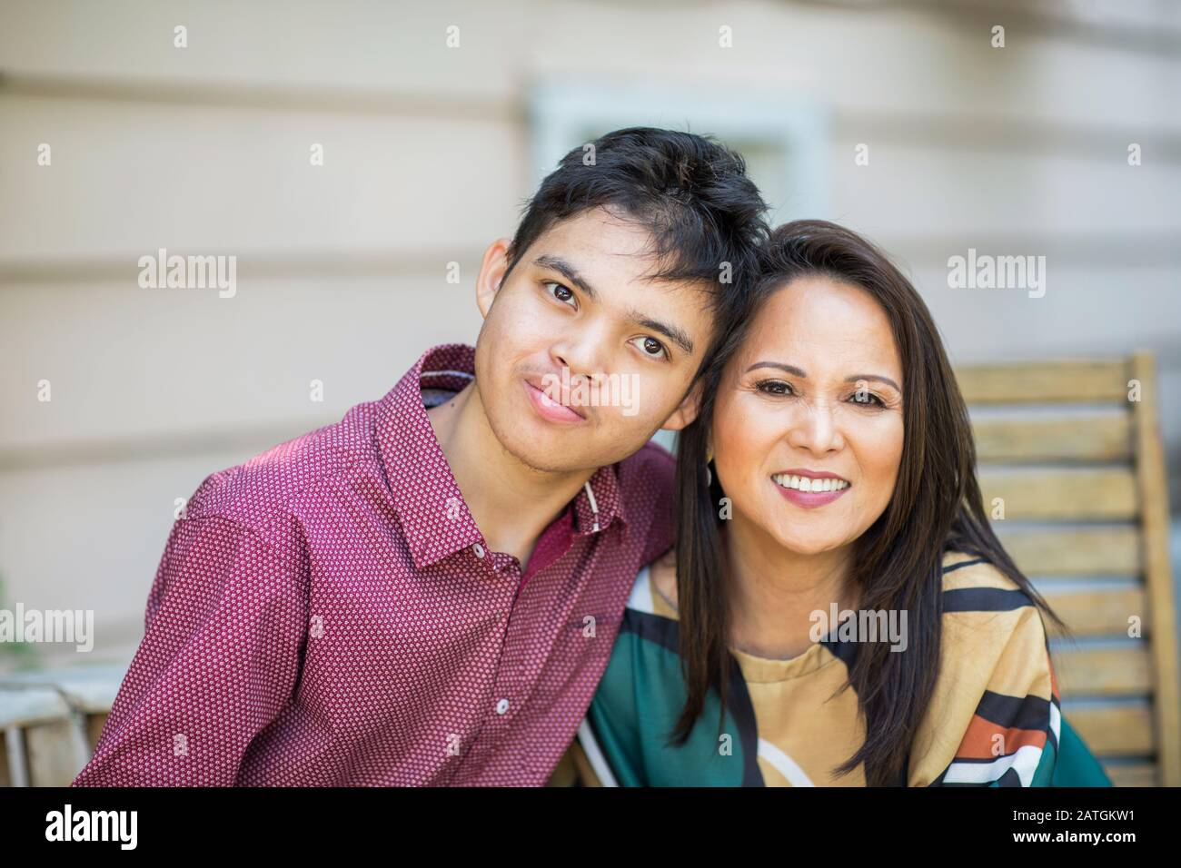 Portrait of an Asian mother with her teenage son. Stock Photo