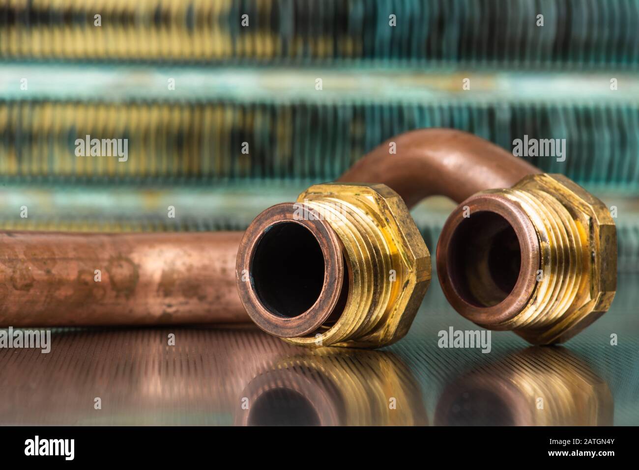 Plumbing brass and copper part on metallic table, old item