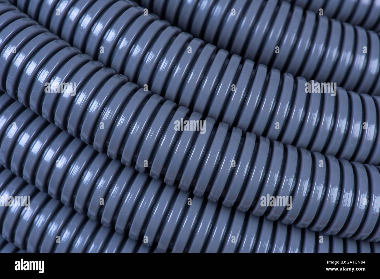 Plastic corrugated pipe tube for electrical installation close-up Stock Photo