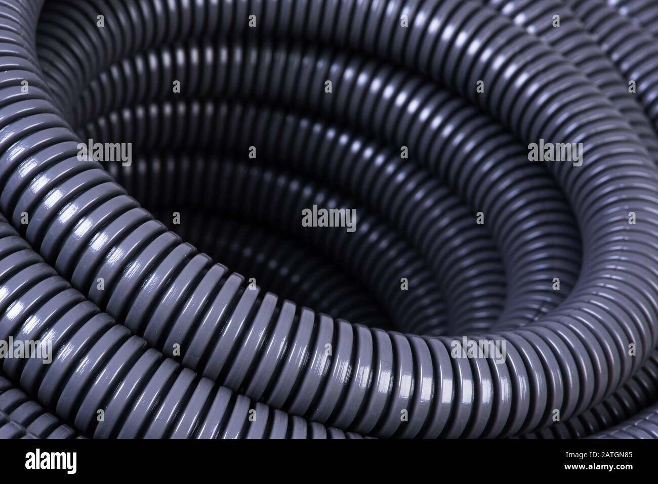 Roll of plastic corrugated pipe for electrical installation close-up Stock Photo