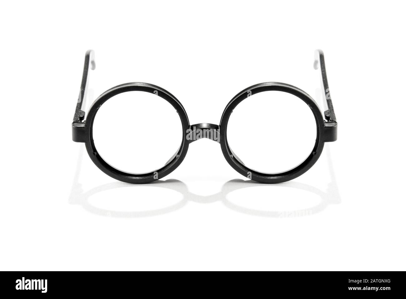 Pair of vintage reading spectacles with round frames isolated on white with reflection Stock Photo