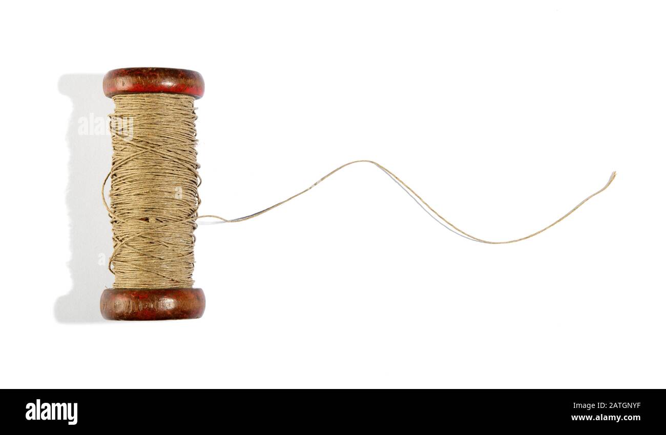 Colored needles and thread reel on patterned fabric placed on the left  side, copy space, white background, top view, sewing and embroidery concept  Stock Photo - Alamy