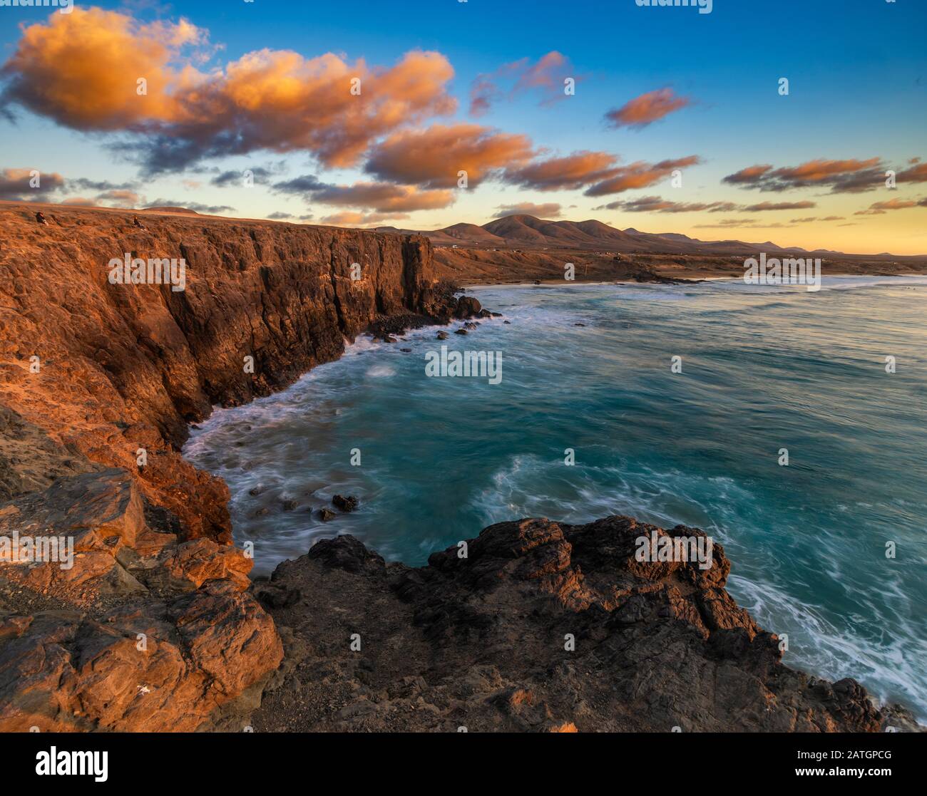 Beautiful sunset on a cliff in Fuerteventura Stock Photo - Alamy