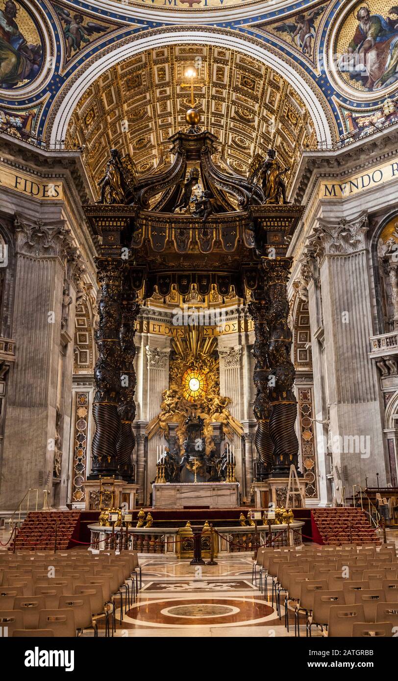 Inside St. Peters basilica looking at the Papal Altar area and Baldacchino, Vatican City, Rome, Italy Stock Photo