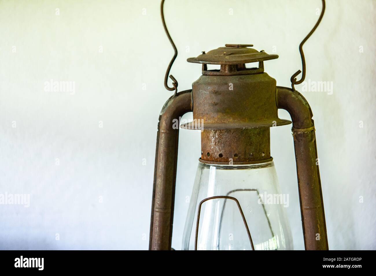 Closeup view of an old rustic kerosene oil lamp. A vintage oil lantern