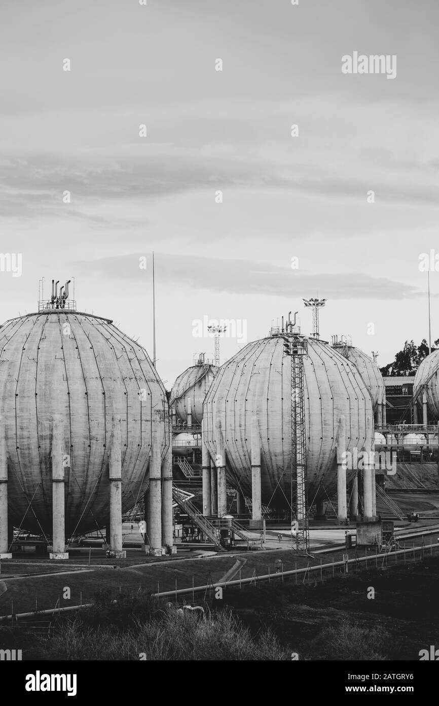 Old gas tanks of spherical form, black and white. Stock Photo