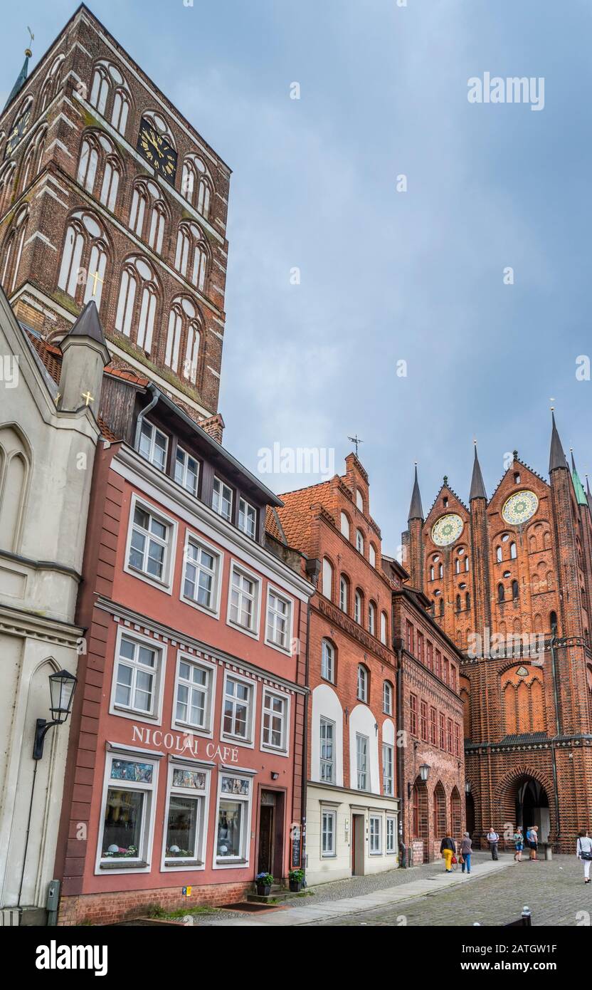 Nikolai Cafe at Stralsund's Old Market Square with view of the tower of St. Nicholas church and Stralsund town hall, Hanseatic town of Stralsund, Meck Stock Photo