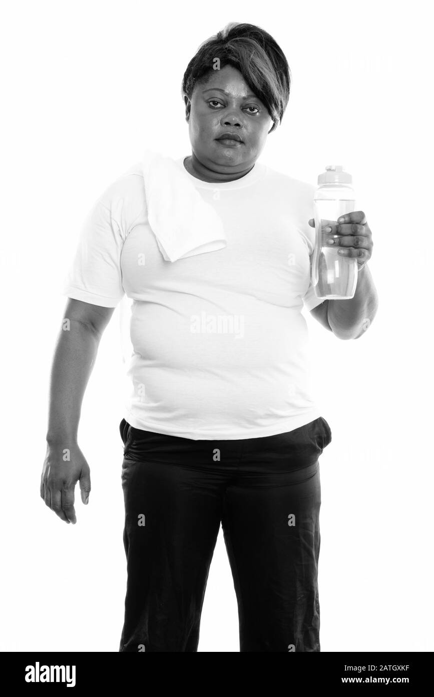 Studio shot of overweight African woman ready for gym Stock Photo