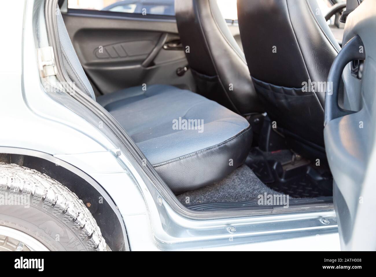 Novosibirsk, Russia - 02.01.2020: The interior of the car lada 2114 samara with a view of therear seats with light gray trim. Auto service industry. Stock Photo