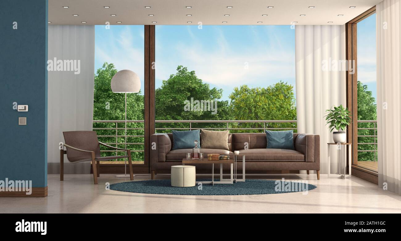 Minimalist living room of a modern villa with leather sofa and armchair - 3d rendering Stock Photo