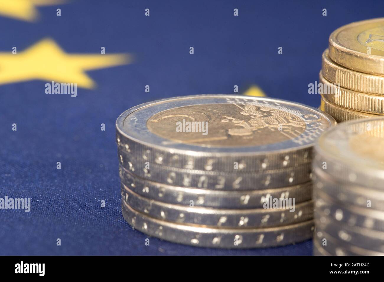 Euro coins and European Union flag Stock Photo