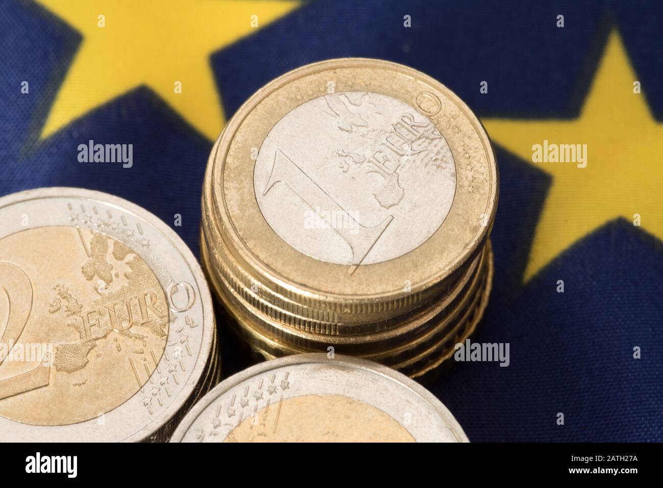 Euro coins and European Union flag Stock Photo