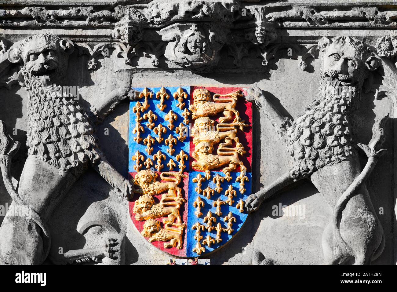 Royal coat of arms above the main entrance to Trinity college, university of Cambridge, England. Stock Photo