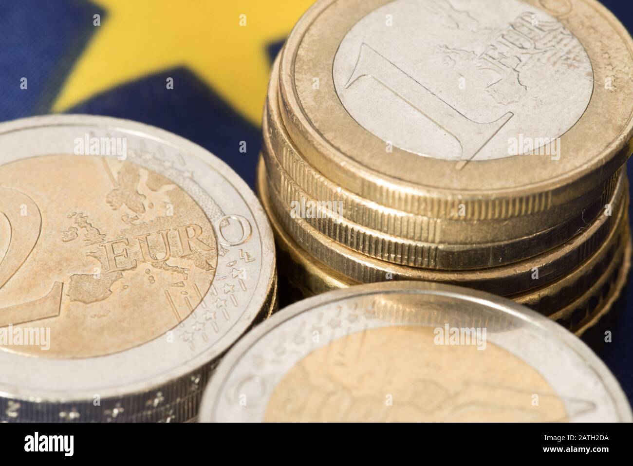 Euro coins and European Union flag Stock Photo