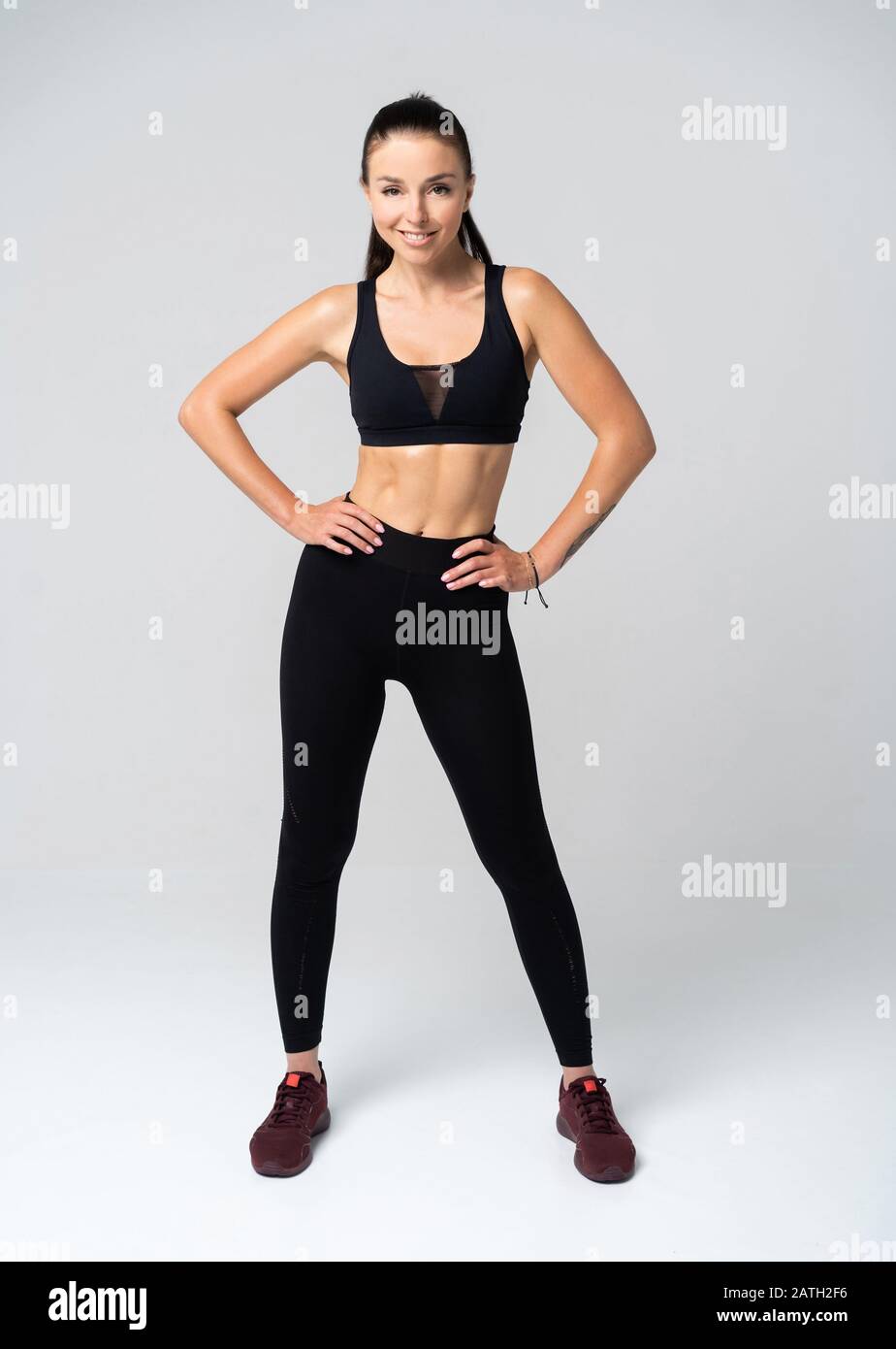 Young fit woman in sports outfit, studio photo Stock Photo