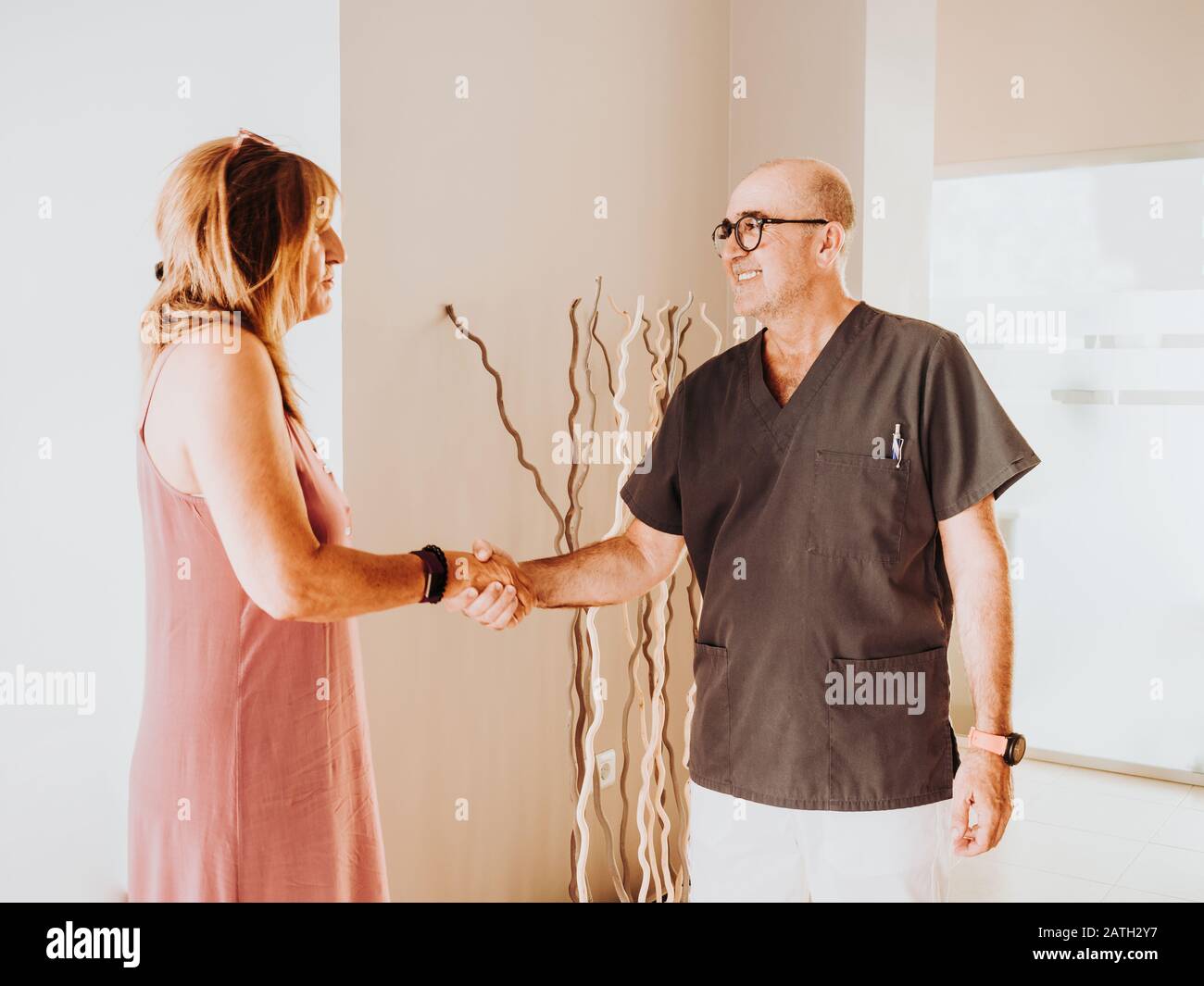 The doctor receives his patient at the clinic Stock Photo