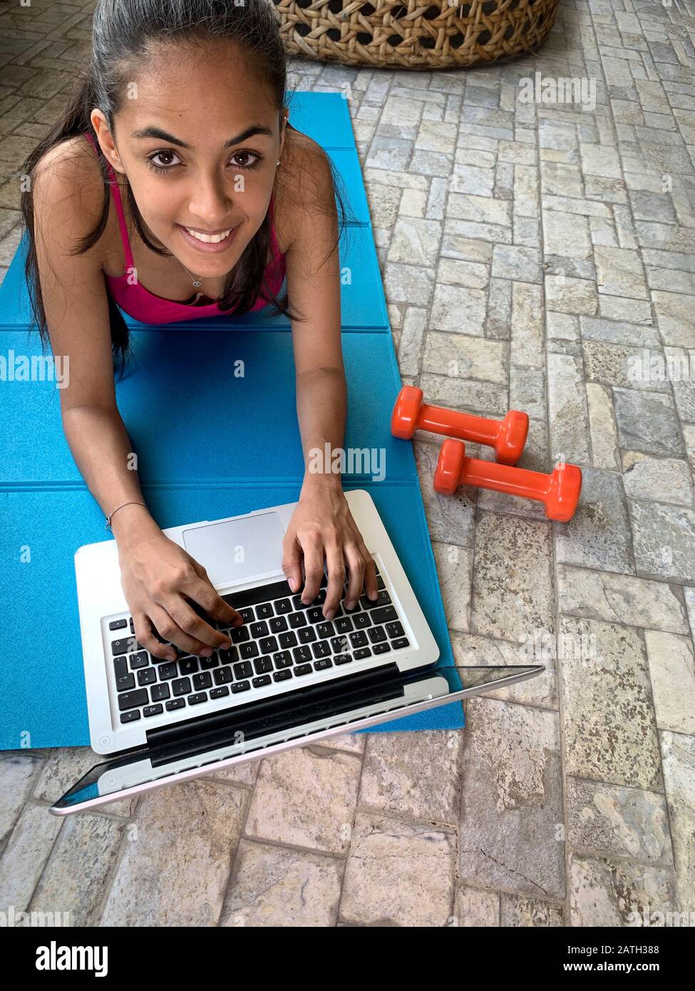 Latin girl exercising at home with a laptop, Panama, Central America Stock  Photo - Alamy