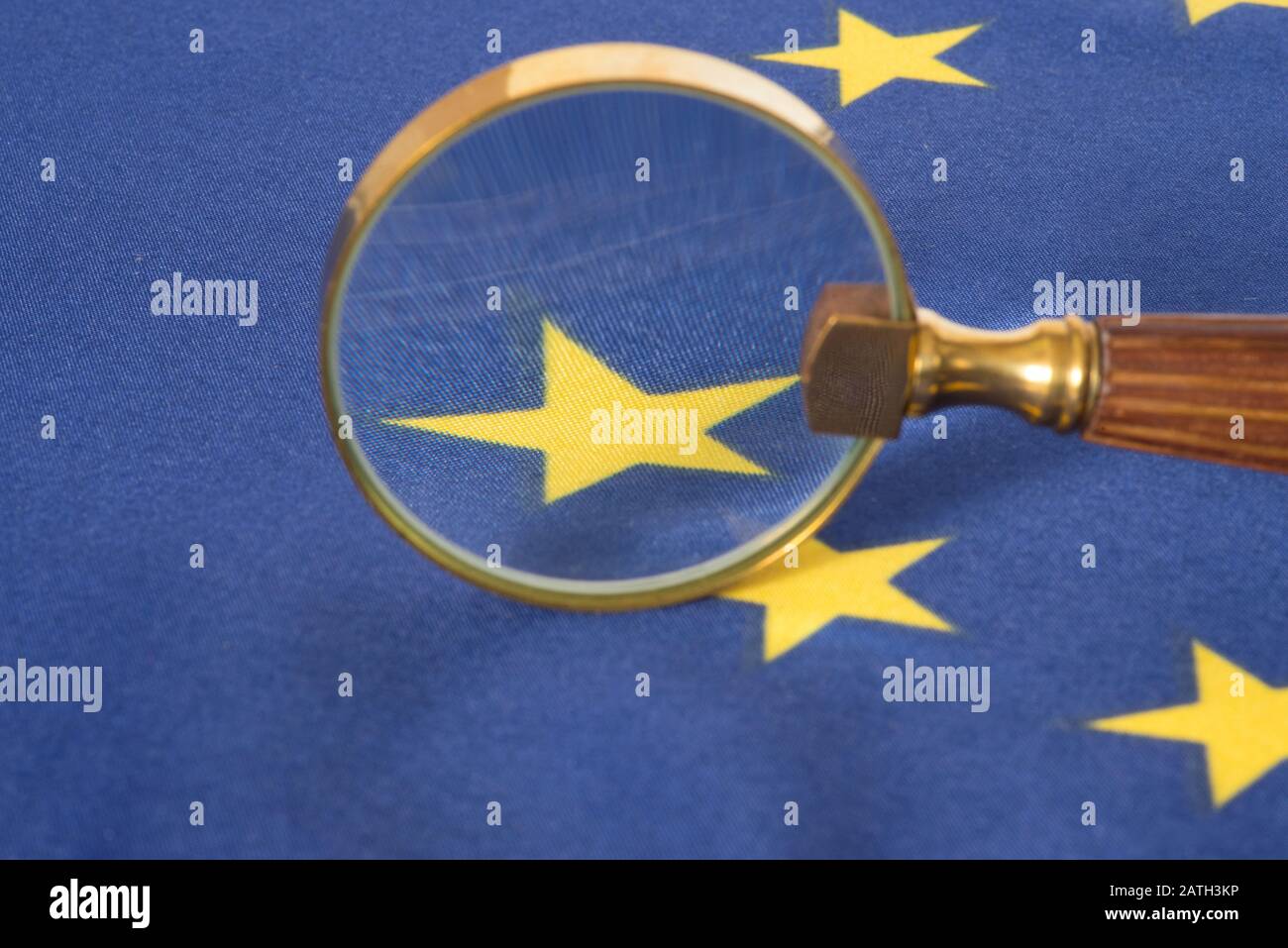 Magnifying glass and flag of the European Union Stock Photo