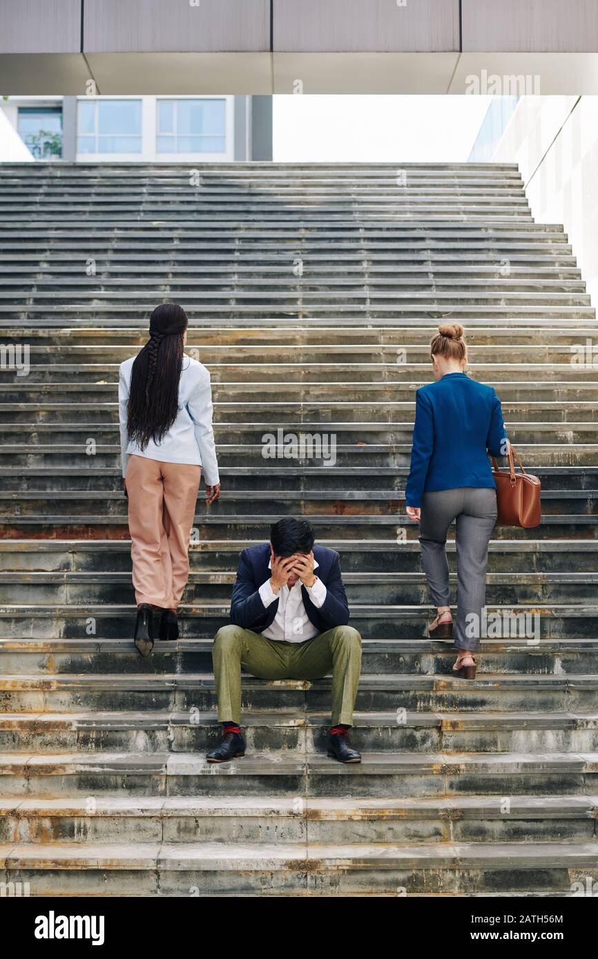 Two business people walking up stairs hi-res stock photography and ...