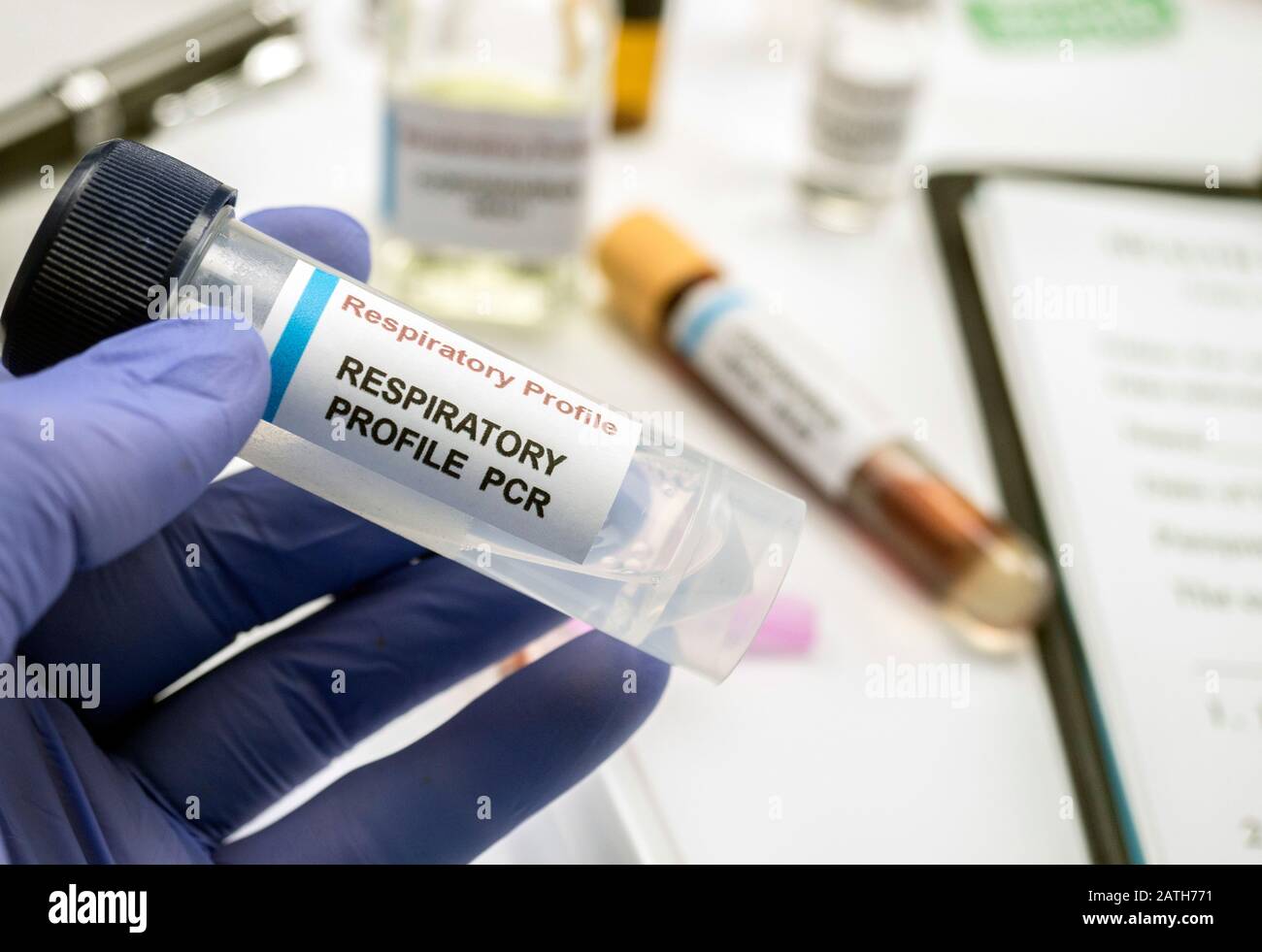 Scientist examines sample of coronavirus in laboratory, conceptual image Stock Photo