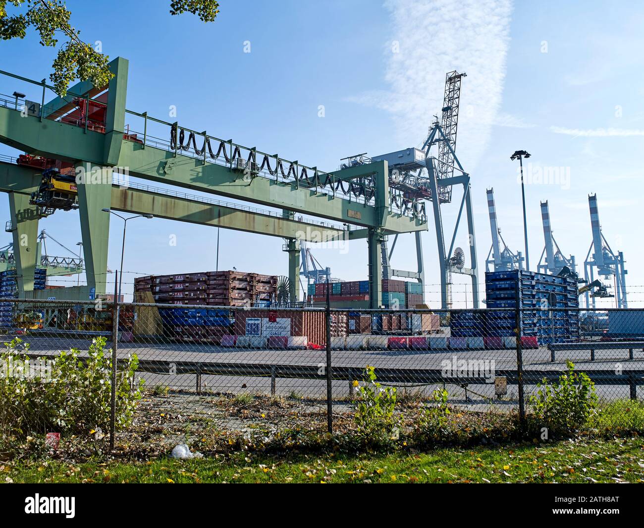 Processing containers at a container Freight Station in  the harbour of Rotterdam, Netherlands Stock Photo