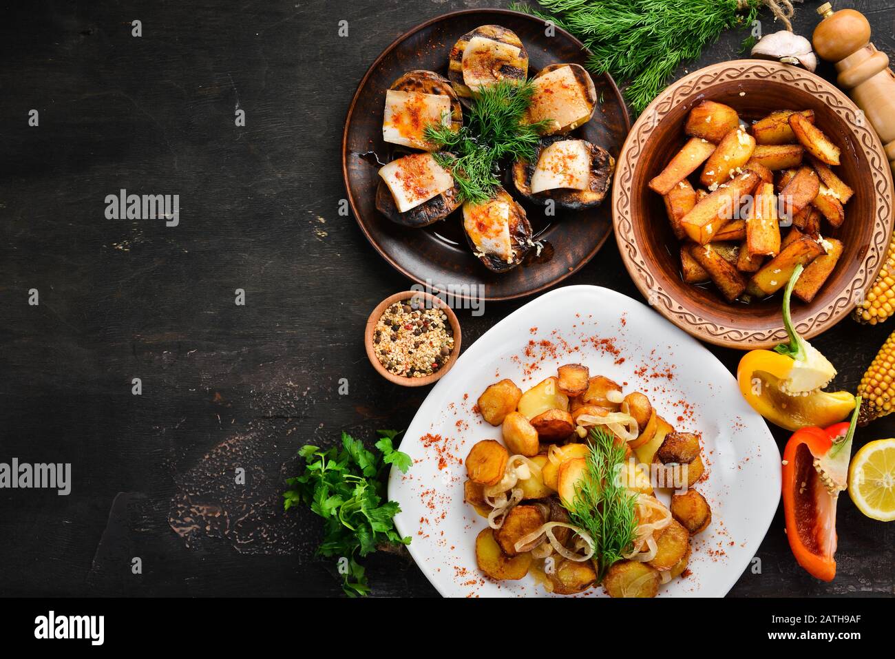 Ukrainian Traditional Cuisine. Fried potatoes. Top view. Free space for your text. Rustic style. Stock Photo