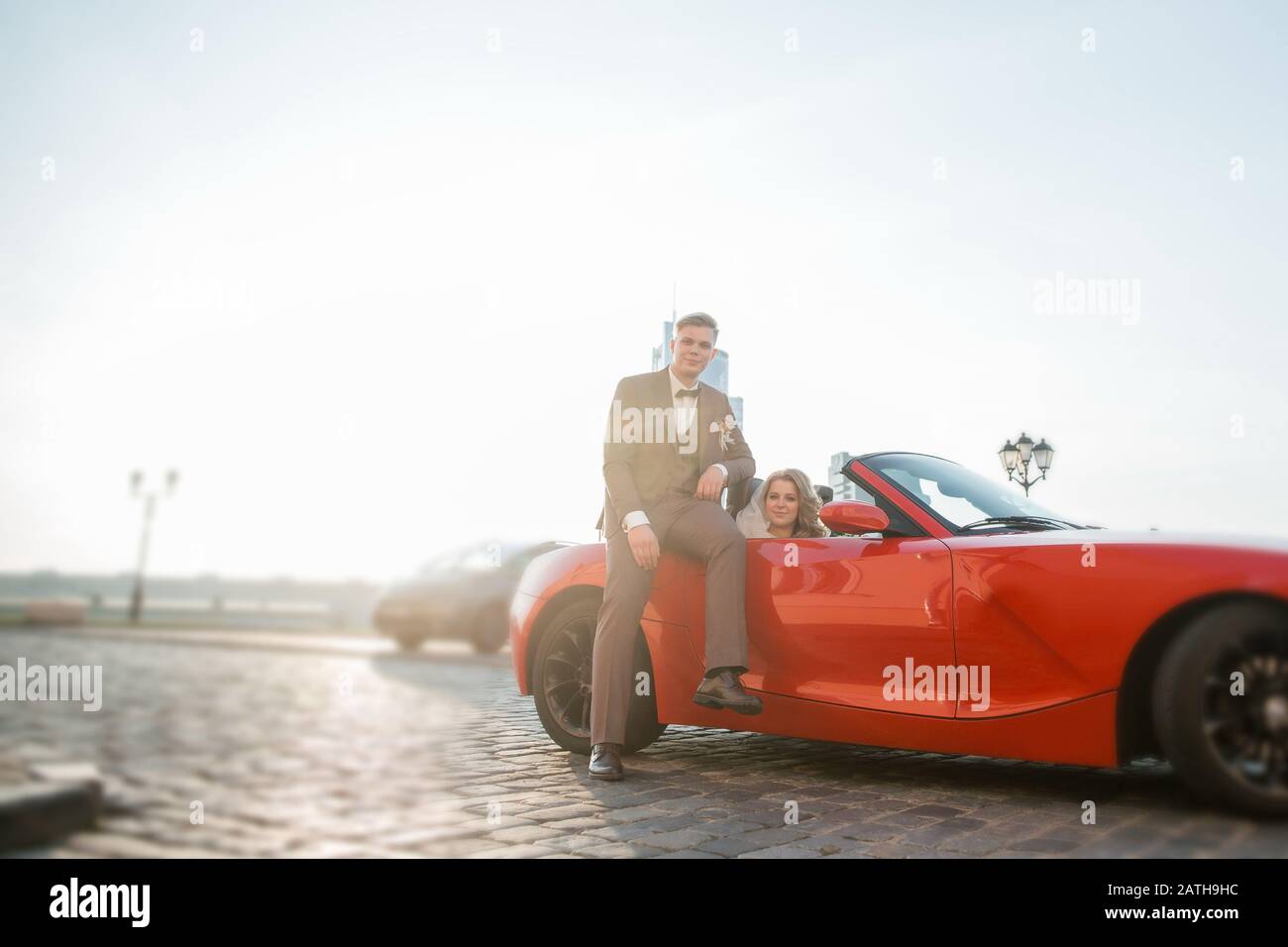 happy bride and groom sitting in a luxury car Stock Photo - Alamy
