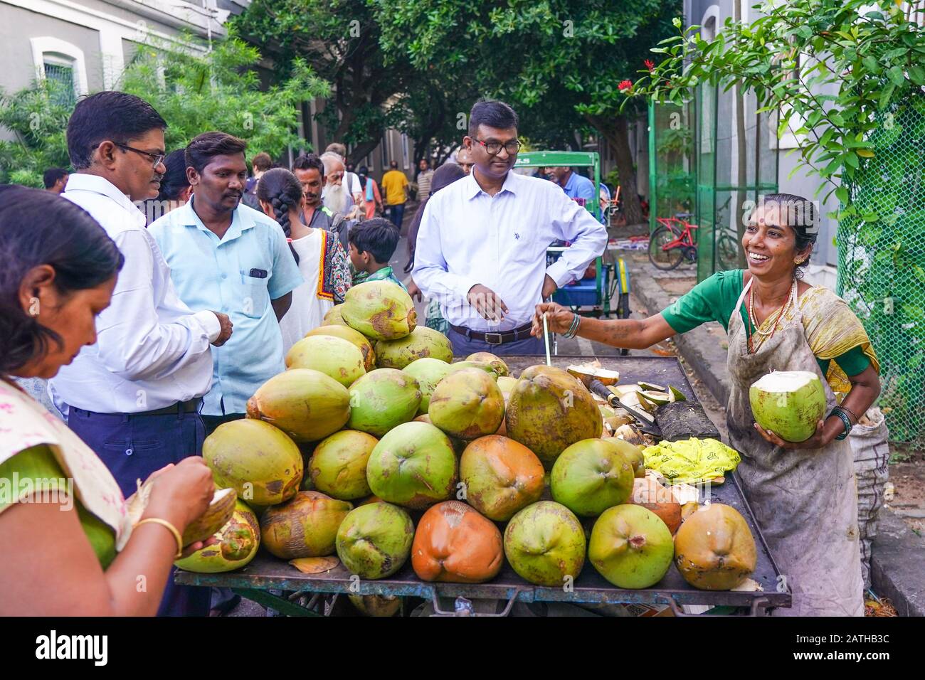 A coconut juice street vendor in Pondicherry. From a series of travel