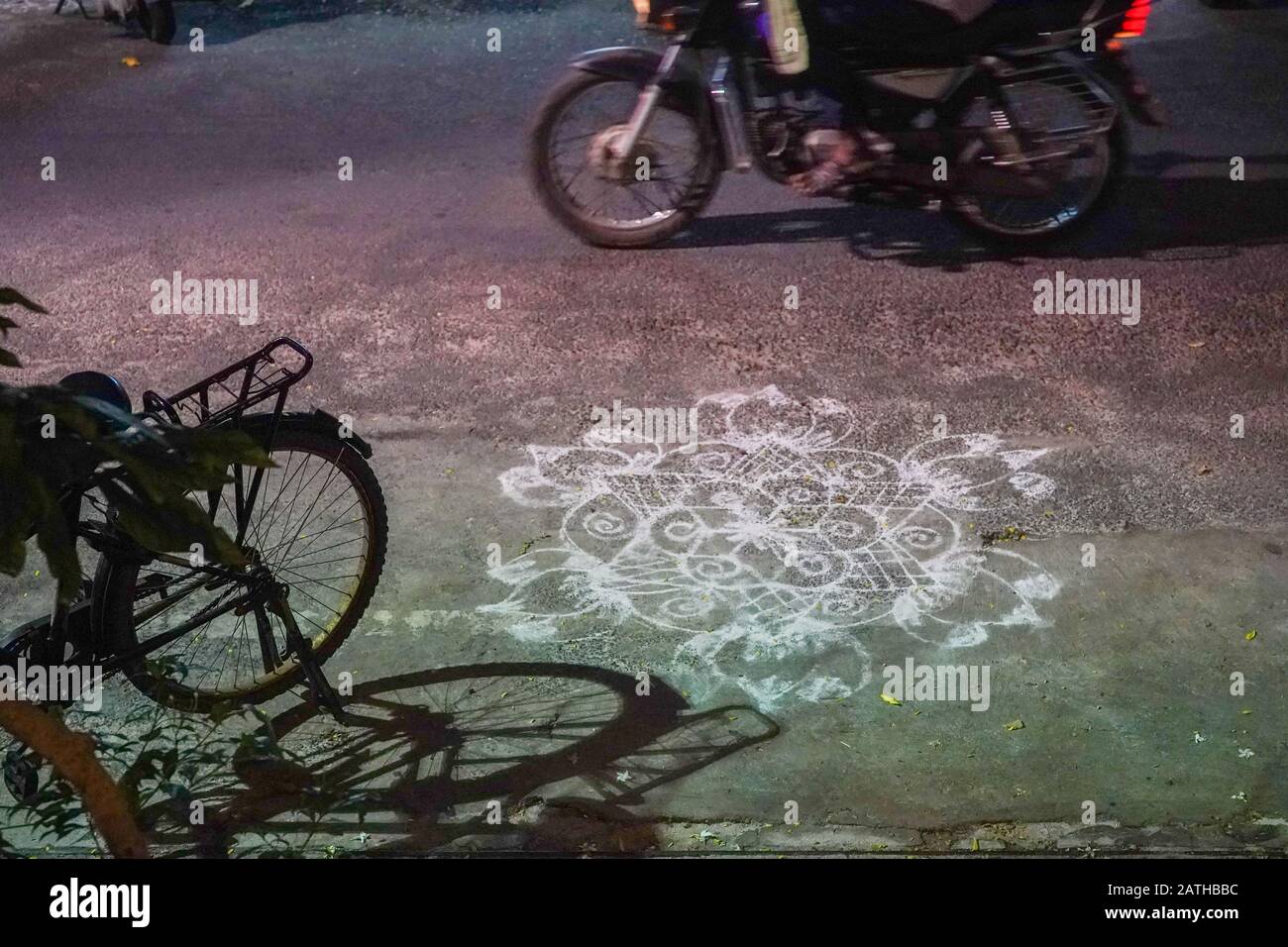 A Hindu chalk drawing known as kolam on a street in Pondicherry. From a