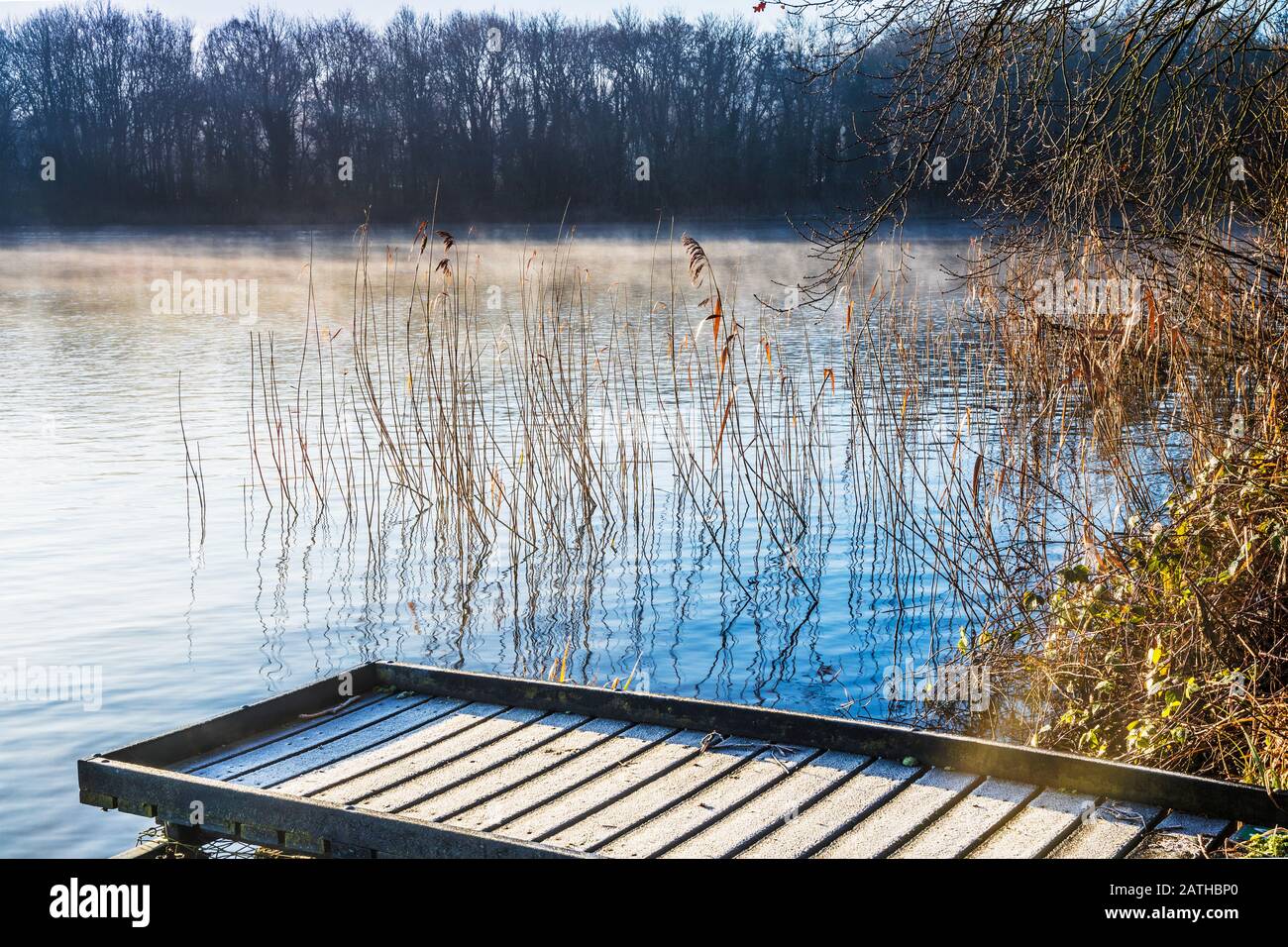 A cold, sunny winter's morning on Coate Water in Swindon. Stock Photo