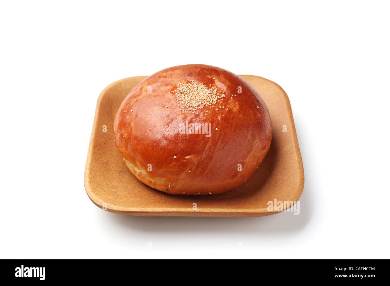 anpan round bread with azuki red beans paste closeup isolated on plate ...